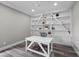 Bright home office with wood floors and custom built in shelving at 3131 Reverence Heights Ln, Las Vegas, NV 89138
