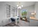 Bright office space with built-in shelving, modern lighting and a view to the outdoors at 3131 Reverence Heights Ln, Las Vegas, NV 89138