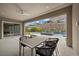 Stylish outdoor dining area on the patio, perfect for enjoying the views of the pool and backyard at 3131 Reverence Heights Ln, Las Vegas, NV 89138