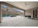 Covered patio offering stunning views, dining area, and seamless access to the backyard pool at 3131 Reverence Heights Ln, Las Vegas, NV 89138