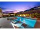 Resort style pool featuring built-in loungers, hot tub, and outdoor entertaining areas at 3131 Reverence Heights Ln, Las Vegas, NV 89138
