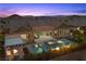 Inviting backyard oasis with a sparkling pool, spa, fire pit, and covered lounge area for outdoor entertaining at 3131 Reverence Heights Ln, Las Vegas, NV 89138