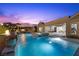 Outdoor oasis with a stunning pool, spa, firepit, and patio area, perfect for entertaining at 3131 Reverence Heights Ln, Las Vegas, NV 89138