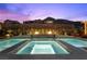 Luxury pool and spa surrounded by manicured landscaping, fire features, and a mountain backdrop at 3131 Reverence Heights Ln, Las Vegas, NV 89138