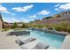 Stunning pool with built-in sun loungers and spa with water feature, perfect for relaxation at 3131 Reverence Heights Ln, Las Vegas, NV 89138