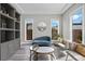 Comfortable sitting area with a stylish couch, chairs, and natural light at 3131 Reverence Heights Ln, Las Vegas, NV 89138