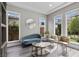 Cozy sitting area with built-in shelving, modern furniture, and natural light at 3131 Reverence Heights Ln, Las Vegas, NV 89138