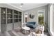 Inviting sitting area with modern decor, built-in shelving and natural light at 3131 Reverence Heights Ln, Las Vegas, NV 89138
