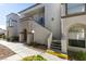Attractive condo building exterior features stucco walls, arched windows, and a well-maintained landscape at 3150 Soft Breezes Dr # 2030, Las Vegas, NV 89128