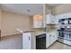 Kitchen with stone countertops, stainless steel appliances, and an open layout at 3150 Soft Breezes Dr # 2030, Las Vegas, NV 89128