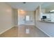 Bright living room featuring tile floors and an open layout adjacent to the kitchen at 3150 Soft Breezes Dr # 2030, Las Vegas, NV 89128