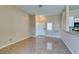 Bright living room featuring tile floors and an open layout adjacent to the kitchen at 3150 Soft Breezes Dr # 2030, Las Vegas, NV 89128