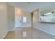 Bright living room featuring tile floors and an open layout adjacent to the kitchen at 3150 Soft Breezes Dr # 2030, Las Vegas, NV 89128