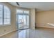 Bright living room with large windows and sliding glass door to the outdoor patio and fireplace at 3150 Soft Breezes Dr # 2030, Las Vegas, NV 89128