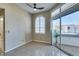 Bright living room with large windows and sliding glass door to the outdoor patio at 3150 Soft Breezes Dr # 2030, Las Vegas, NV 89128