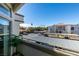 Balcony offers parking views, desert vegetation, and stucco architectural elements at 3150 Soft Breezes Dr # 2030, Las Vegas, NV 89128