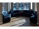 Cozy sitting area with plush blue seating overlooking a tranquil lake and fountain at 3150 Soft Breezes Dr # 2030, Las Vegas, NV 89128
