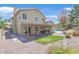 The backyard features a covered patio, green turf, and access to the inviting pool area; ideal for entertaining at 349 Clayton St, Henderson, NV 89074
