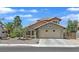 Charming single-Gathering home with a two-car garage, tile roof, and low-maintenance desert landscaping at 349 Clayton St, Henderson, NV 89074