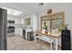 Well-lit kitchen with stainless steel appliances and a dining area with views of the backyard at 349 Clayton St, Henderson, NV 89074