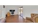 Versatile living space with hardwood floors, natural light, and slider door access to the backyard at 349 Clayton St, Henderson, NV 89074