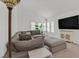 Cozy living room featuring a plush sectional sofa, vaulted ceiling, and natural light at 349 Clayton St, Henderson, NV 89074