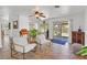 Inviting living room with two white chairs and tile floors, with views of the backyard at 349 Clayton St, Henderson, NV 89074
