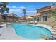 Inviting swimming pool with lounge chairs and lush greenery; your own private oasis at 349 Clayton St, Henderson, NV 89074