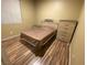 Bedroom with wood floors, Queen bed, and decorative dresser at 3562 Driving Range St, Las Vegas, NV 89122