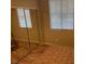Bedroom featuring mirrored closets, window with blinds and wood flooring at 3562 Driving Range St, Las Vegas, NV 89122