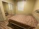 Bedroom with mirrored closet, Queen bed, and wood flooring at 3562 Driving Range St, Las Vegas, NV 89122