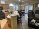 Living room with combined kitchen and dining area adjacent to the fireplace at 3562 Driving Range St, Las Vegas, NV 89122