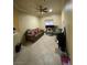 A view of the office area featuring a comfortable couch and a large desk at 3562 Driving Range St, Las Vegas, NV 89122