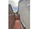 Side yard with brick pathway leading to gate, and security camera at 3562 Driving Range St, Las Vegas, NV 89122