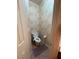 Toilet room featuring a toilet, textured wallpaper, and tile flooring at 3562 Driving Range St, Las Vegas, NV 89122