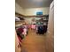 Walk-in closet with lots of shelving and hanging racks for storage at 3562 Driving Range St, Las Vegas, NV 89122