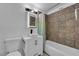 Cozy bathroom with decorative tile and modern fixtures including a square sink at 3727 Hazelwood St # 12, Las Vegas, NV 89119