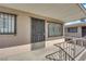 Welcoming porch with a secure entrance door and decorative window bars for peace of mind at 3727 Hazelwood St # 12, Las Vegas, NV 89119
