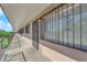 Long hallway with secure doors, gated windows, and a covered walkway for convenience and protection at 3727 Hazelwood St # 12, Las Vegas, NV 89119