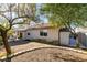 Home exterior shows a yard with shade trees and covered patio area for outdoor relaxation at 3816 Sunking St, Las Vegas, NV 89130