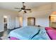 Primary bedroom with ceiling fan, lots of light, and space for everything at 3816 Sunking St, Las Vegas, NV 89130