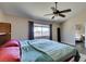 Comfortable primary bedroom features a ceiling fan, lots of light, and room to roam at 3816 Sunking St, Las Vegas, NV 89130