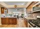 A kitchen featuring warm cabinets, granite countertops, and stainless appliances at 3816 Sunking St, Las Vegas, NV 89130