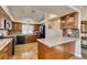 A kitchen featuring warm cabinets, granite countertops, and black appliances at 3816 Sunking St, Las Vegas, NV 89130