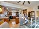 An eat-in kitchen featuring warm cabinets, granite countertops, and black appliances at 3816 Sunking St, Las Vegas, NV 89130