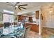 An eat-in kitchen featuring warm cabinets, granite countertops, and stainless steel appliances at 3816 Sunking St, Las Vegas, NV 89130