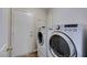 Convenient laundry room featuring modern washer and dryer units with easy access to outside at 3816 Sunking St, Las Vegas, NV 89130