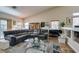 Relaxed living area with comfortable grey sofa, accent lighting, and open access to dining at 3816 Sunking St, Las Vegas, NV 89130