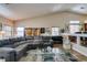 Cozy living room featuring natural light, comfortable seating, and a seamless flow to the dining area at 3816 Sunking St, Las Vegas, NV 89130