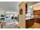 Open-concept living space features elegant tile floors, gourmet kitchen and comfortable living area at 3816 Sunking St, Las Vegas, NV 89130